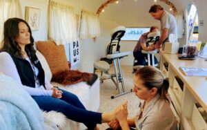 Chair massage and foot massage at workplace in TulaBlu Airstream